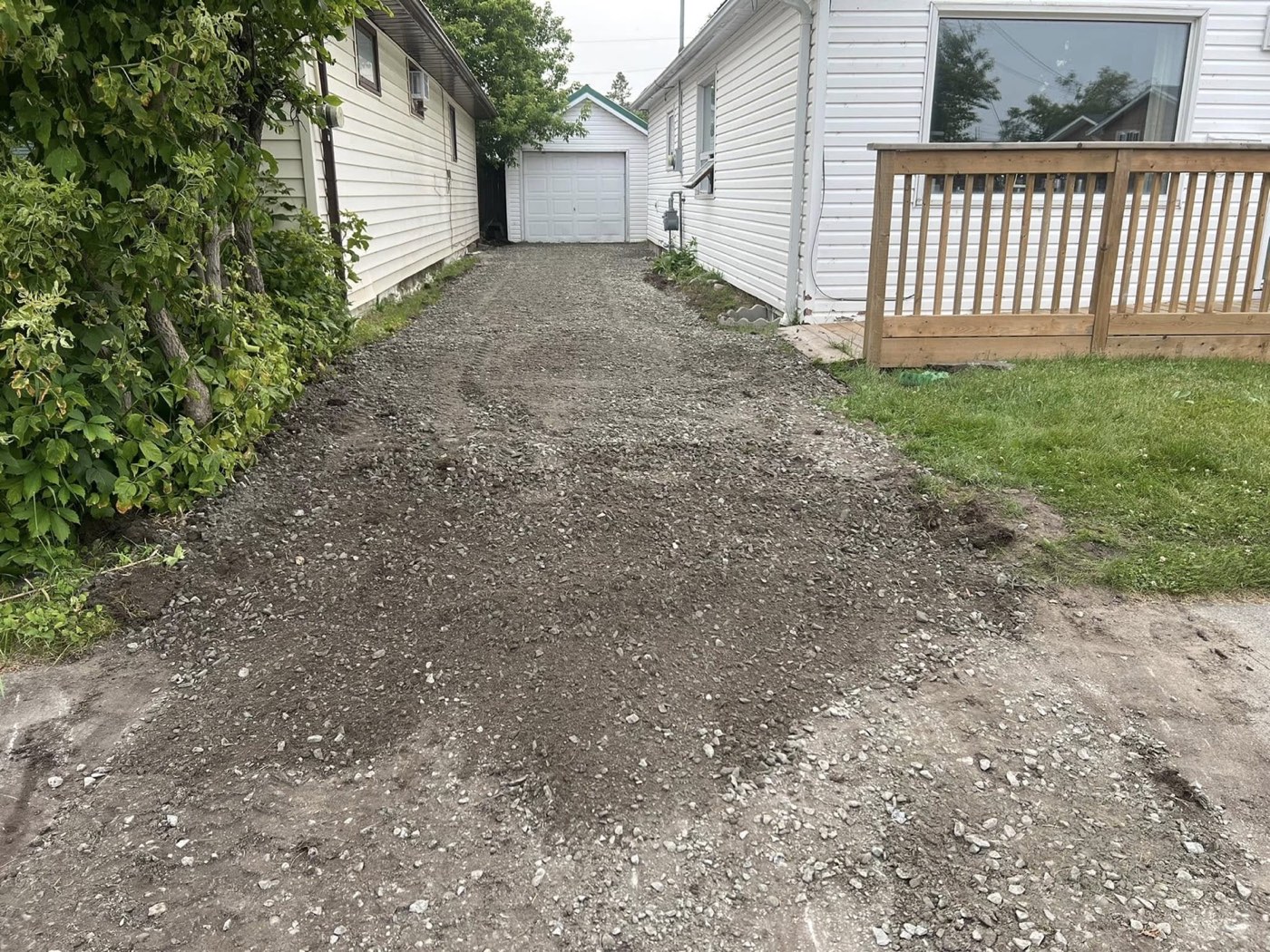 Regraded and cleared gravel driveway after repair