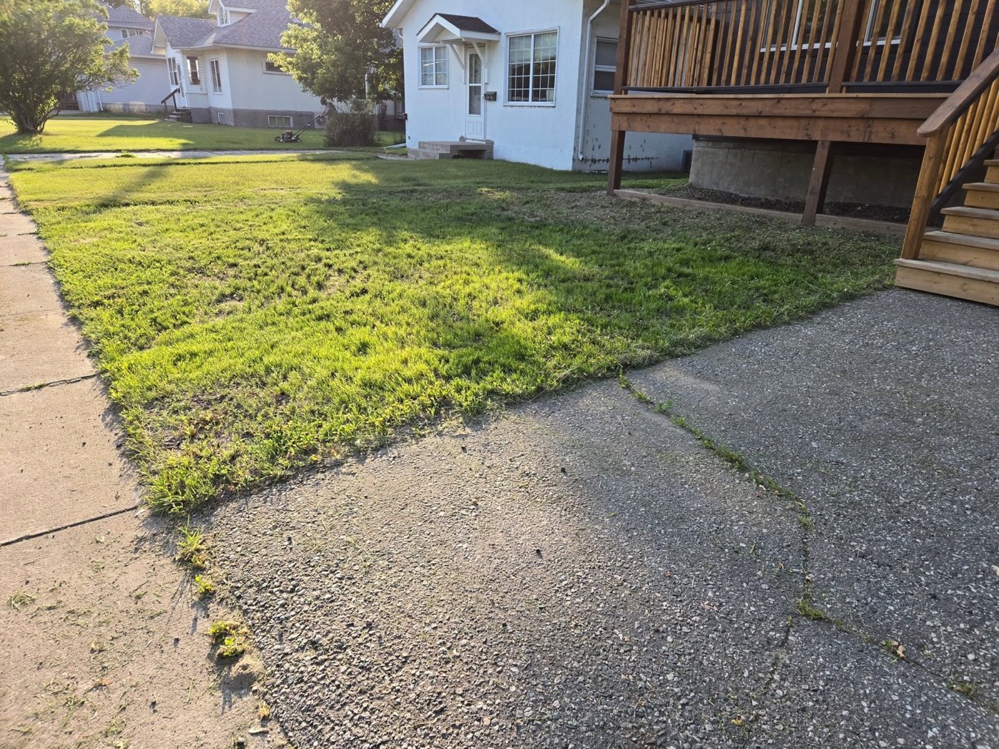 A freshly mowed, crisply edged front lawn completed by RL Property Maintenance in Fort Frances