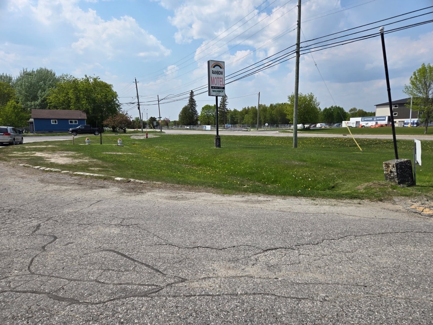 Commercial property lawn overgrown before service